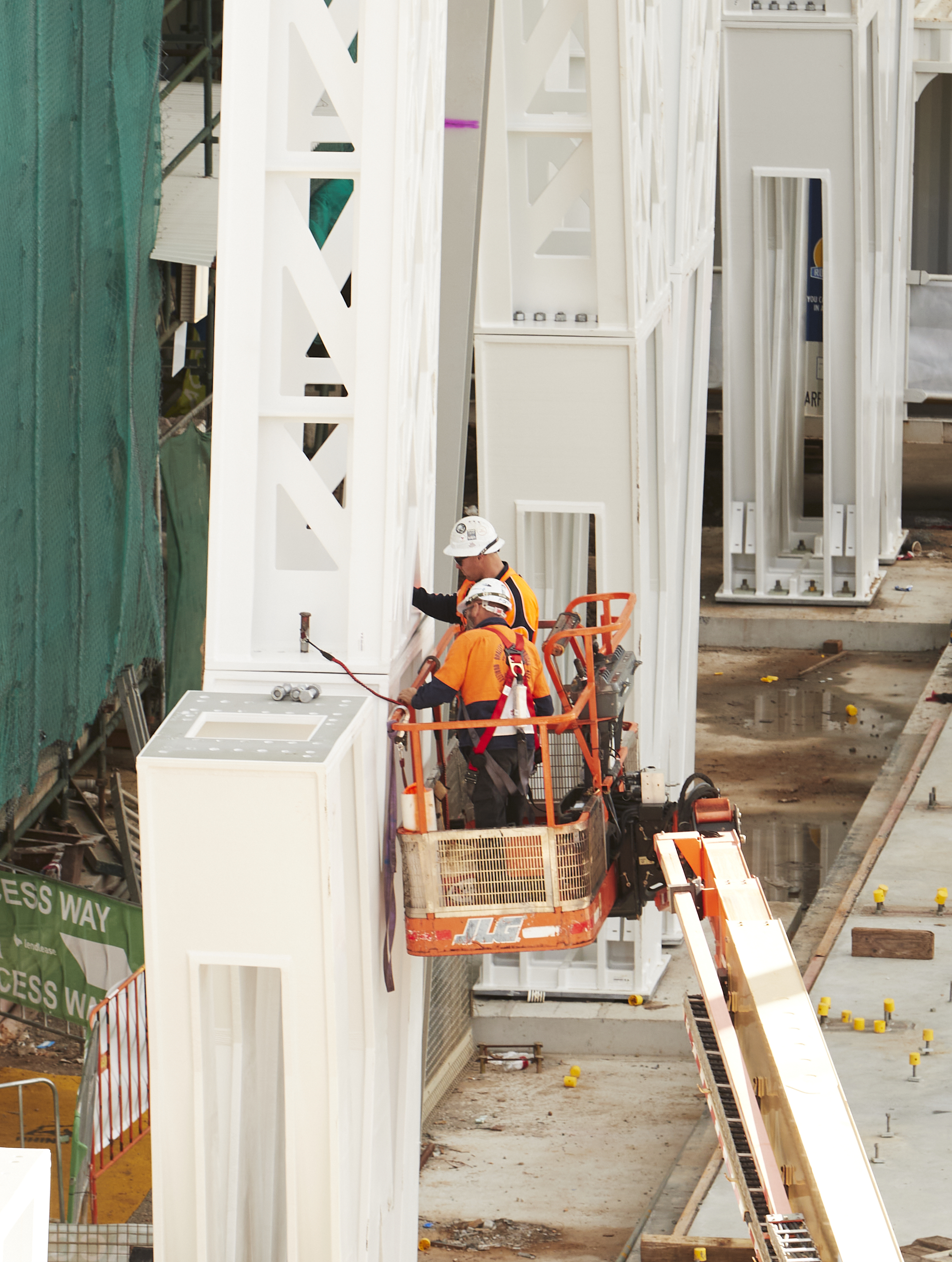 Two construction workers on crane. Image credit: zan wimberley 